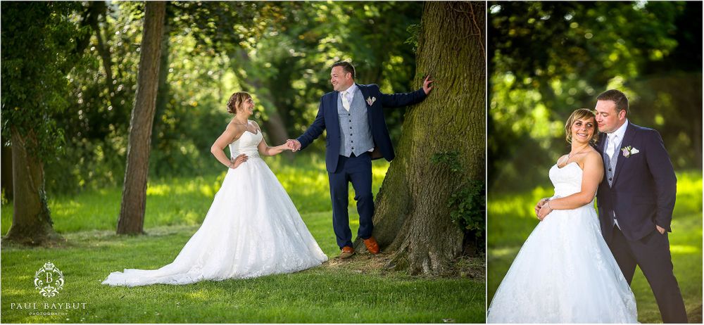 Romantic wedding portraits in a lush green garden setting with natural lighting.