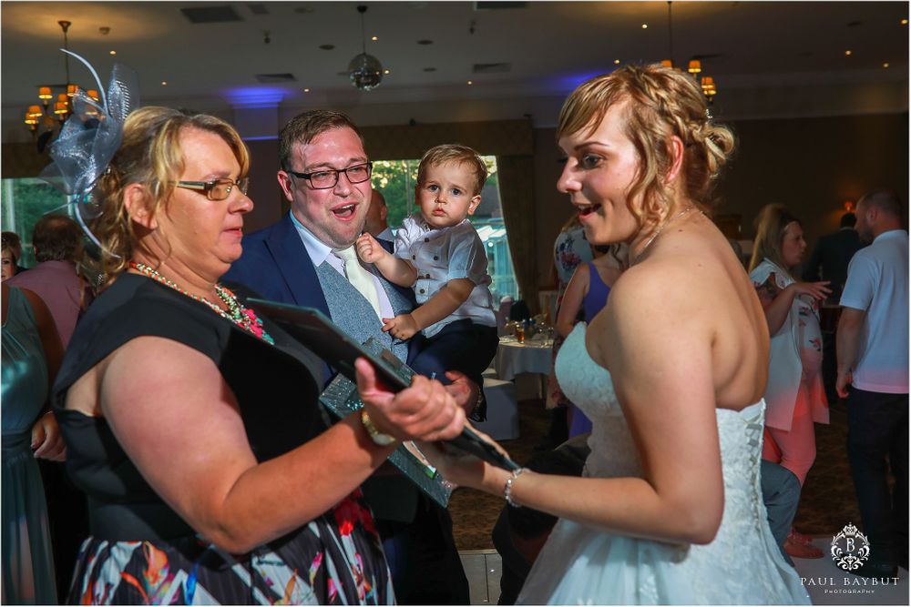 Wedding guests dancing and celebrating together during the reception.