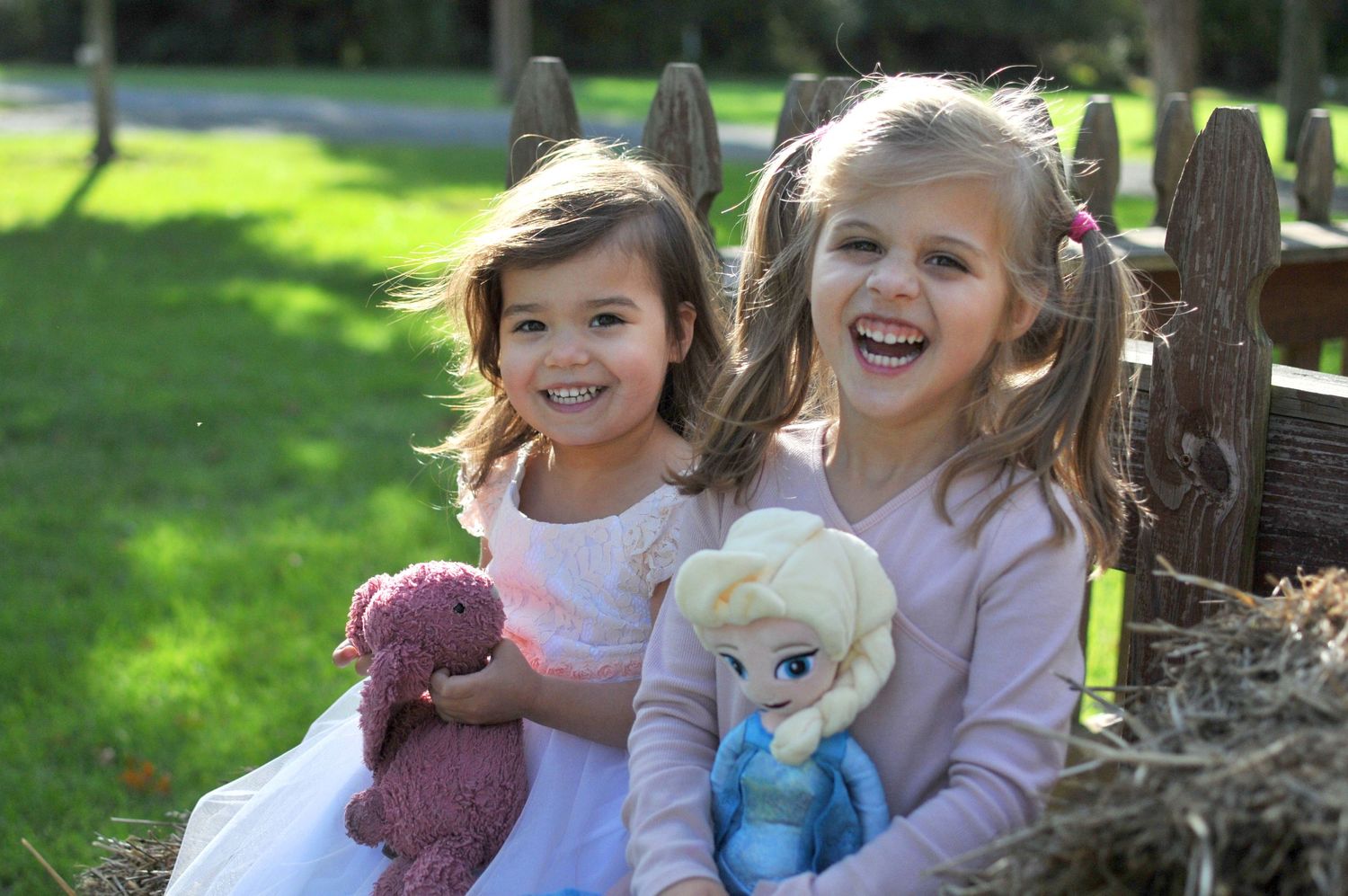 Two sisters laughing outside fall photo Claude Moore Park