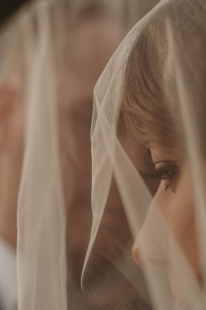 Close up detail of delicate bridal veil fabric with soft focus.