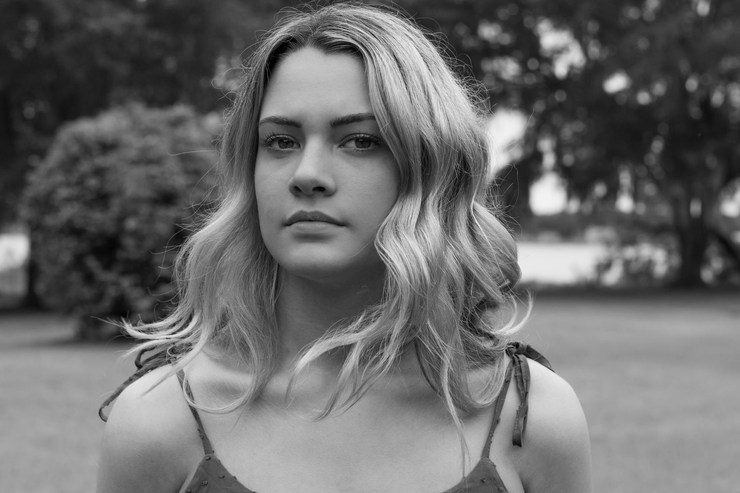 Black and white portrait series showing different expressions and angles.