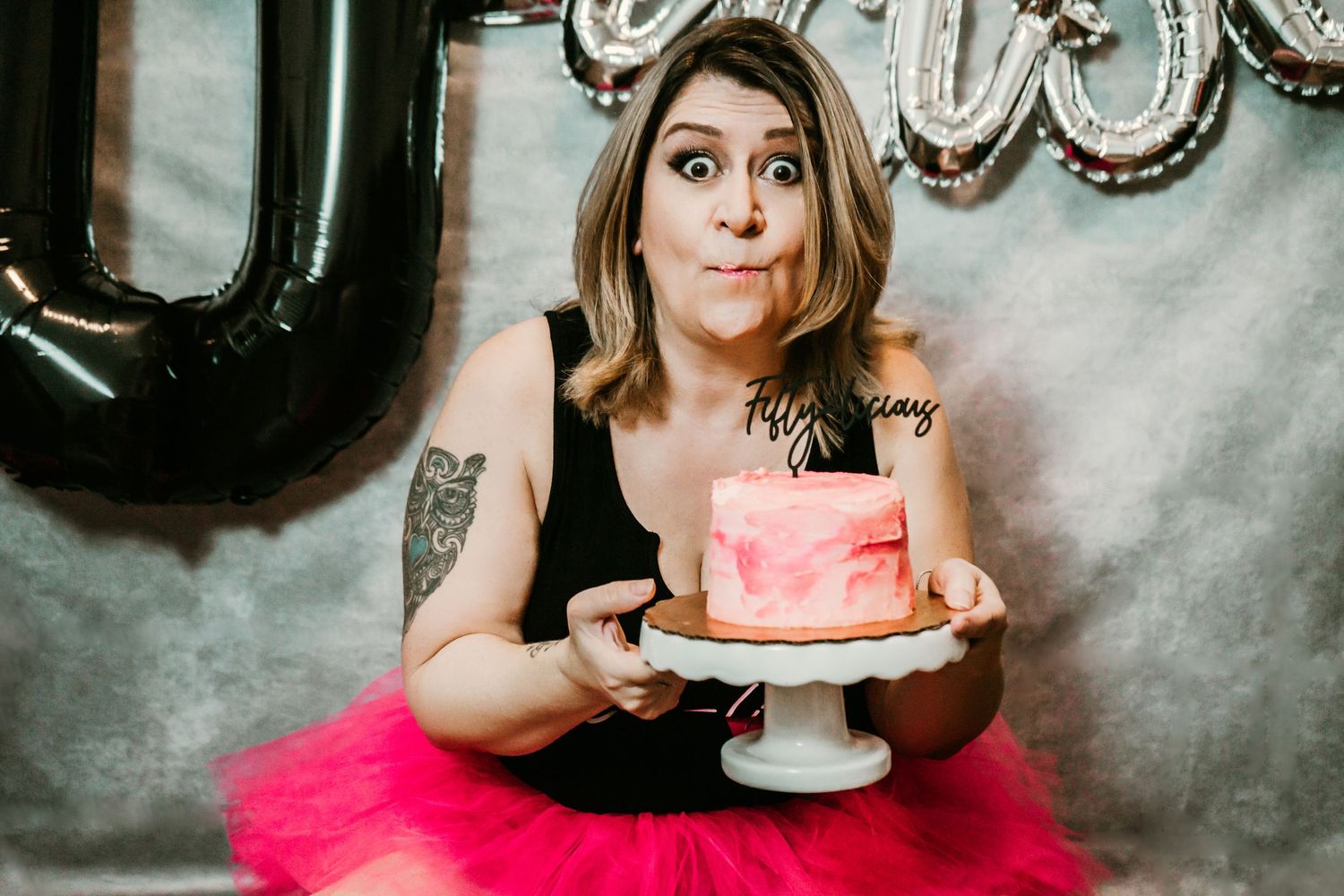 Studio Cake Smash Session in Home Ruskin, FL; Woman eating cake
