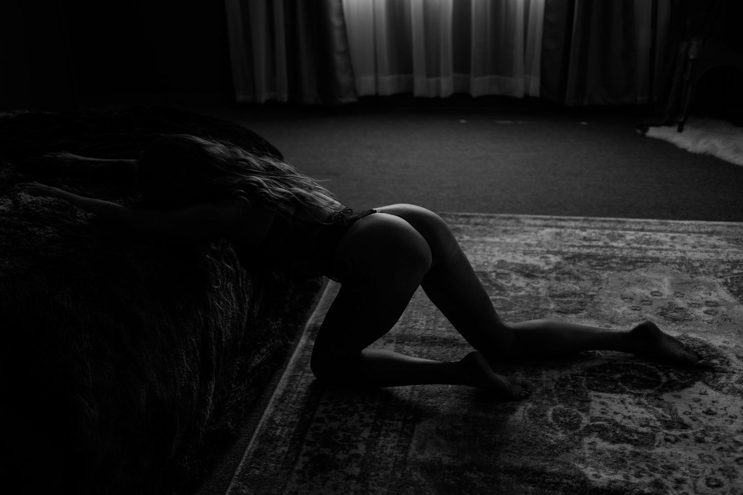 Artistic black and white silhouette photography in moody lighting.