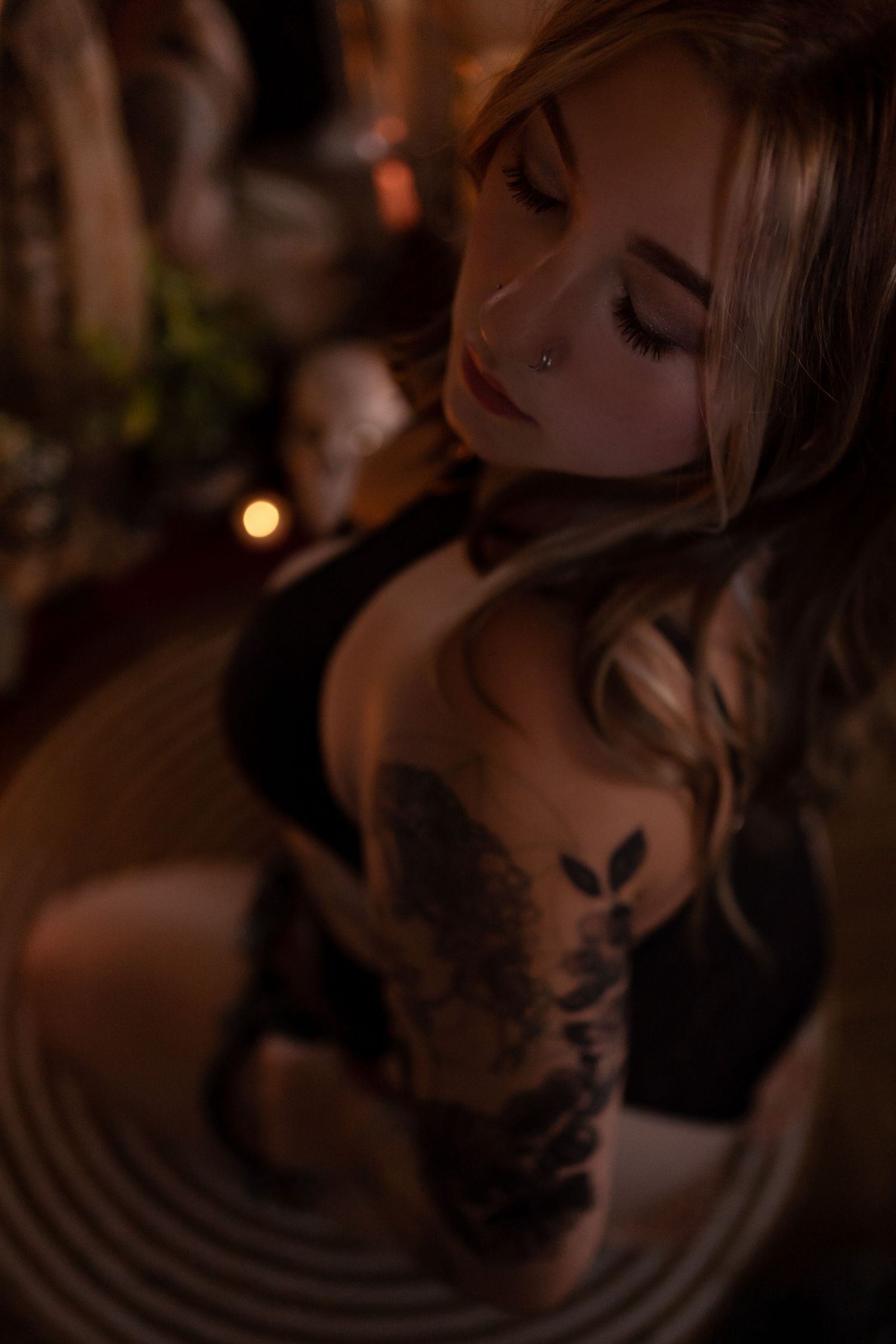 Intimate portrait series with warm lighting and artistic body paint details.
