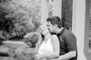 couple laughing during fun candid engagement photoshoot in Panama City Florida