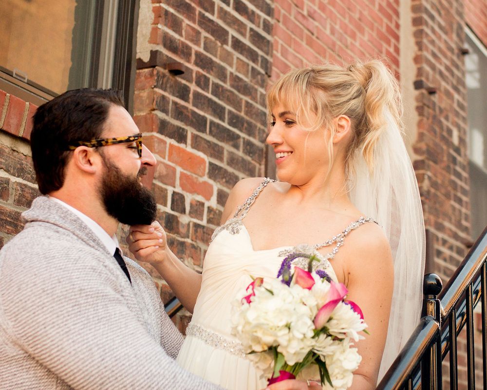 A series of romantic wedding photos captured on vintage brick steps with iron railings.
