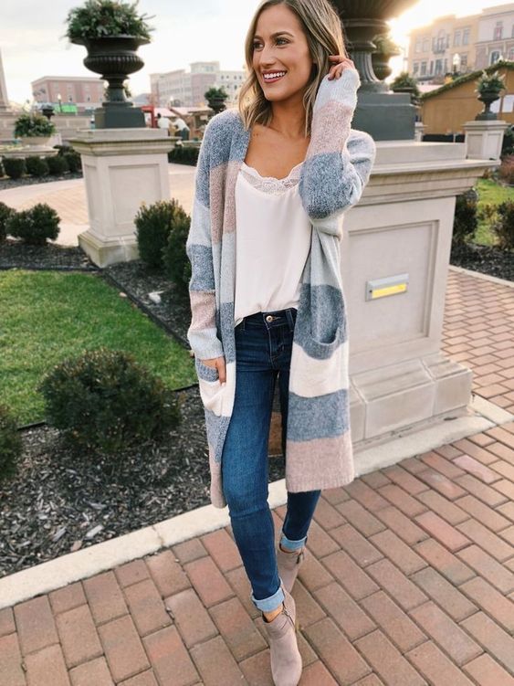 Cozy striped cardigan paired with white tank top, fitted jeans and neutral ankle boots.
