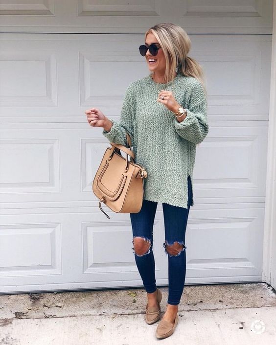 Sage green sweater styled with distressed jeans, tan booties and matching handbag.