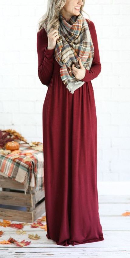 Burgundy maxi dress paired with plaid blanket scarf in cozy fall setting.