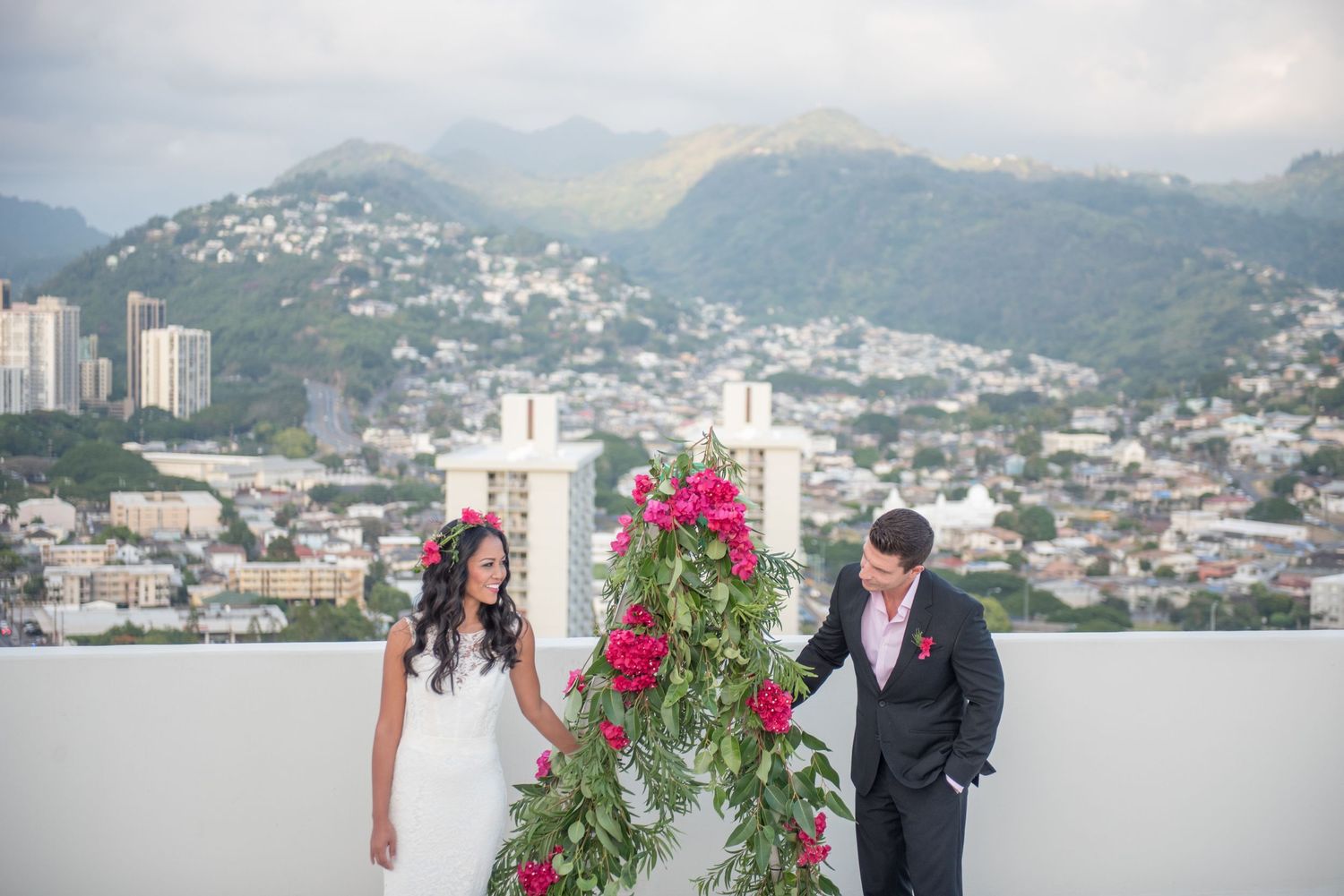 Bride and Groom on rooftop overlooking Honolulu