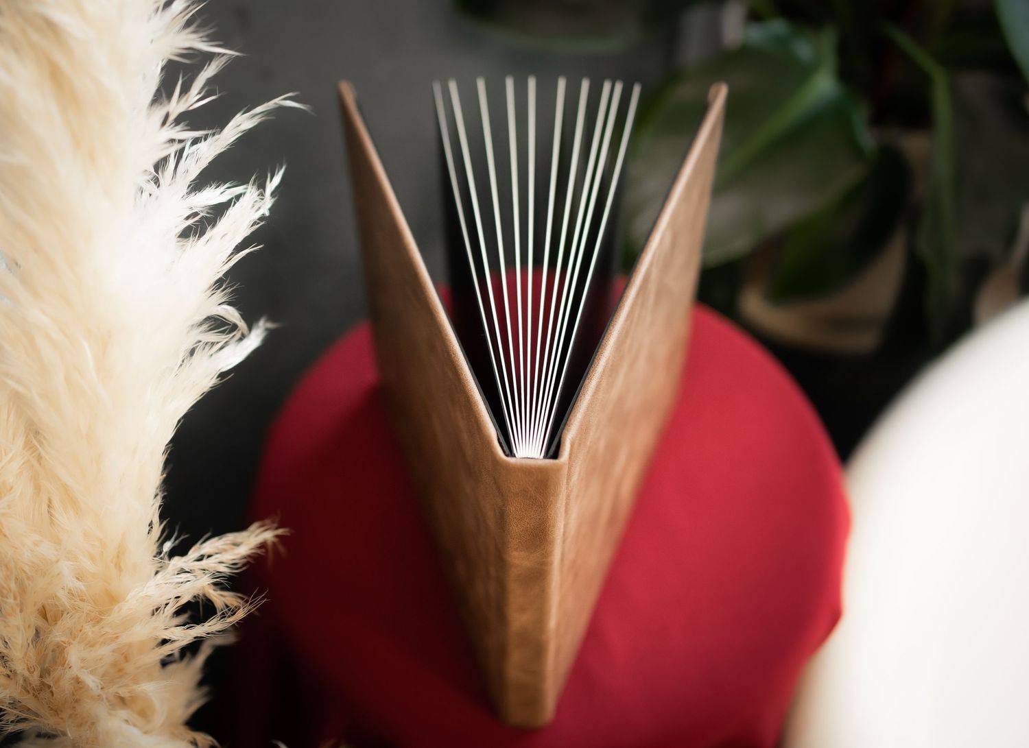 brown custom album on a red chair