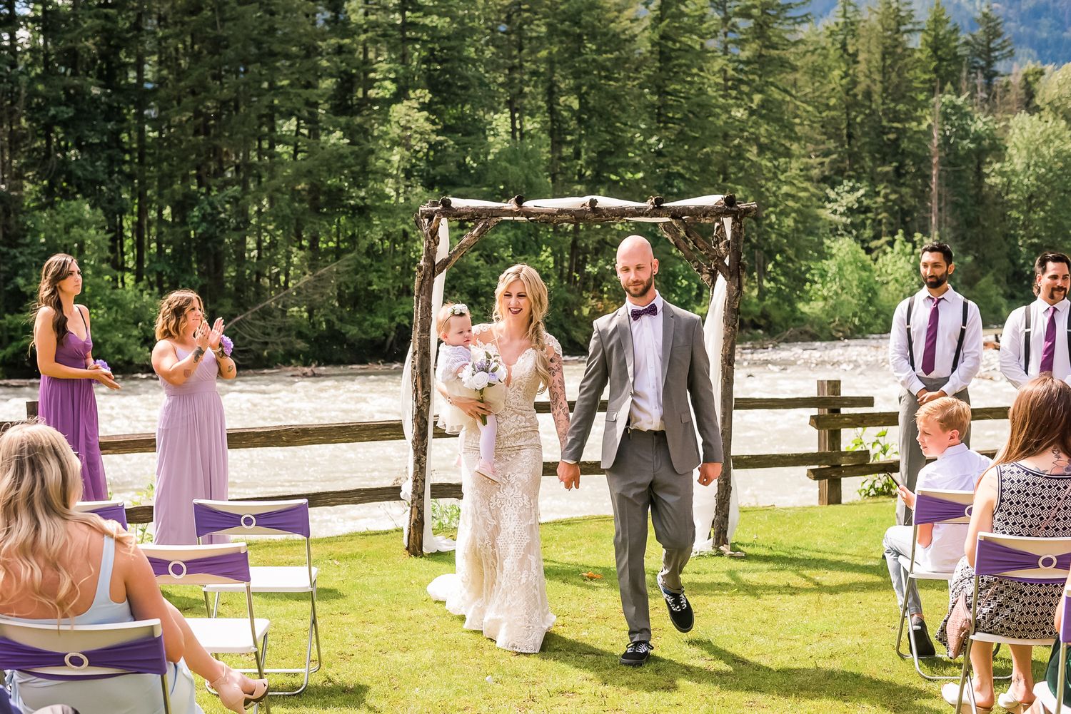 Everyone claps for the bride and groom. Photo taken by Vancouver wedding photographer, Kari Mills Photography.