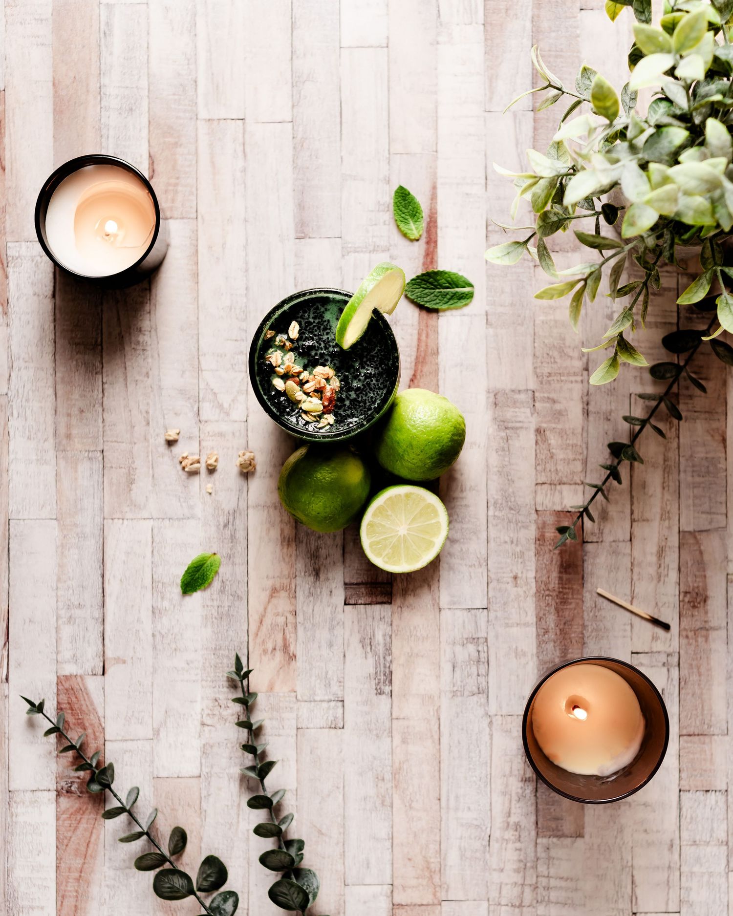 green superfood smoothie with nuts, limes and candles, healthy eating stock photos, clean eating