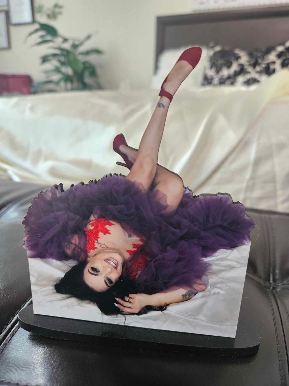 Photo of person in purple tulle dress displayed on laptop screen.