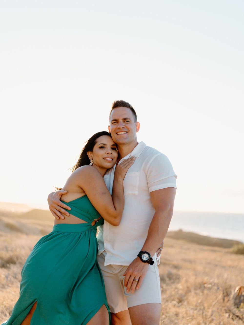 A couples photoshoot by Moments With Kell on Oahu in Hawaii with wife and husband smiling