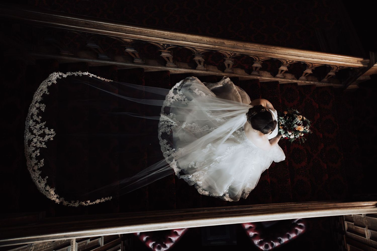 Wedding photo gallery showing a flowing white veil against a rustic wooden beam background.