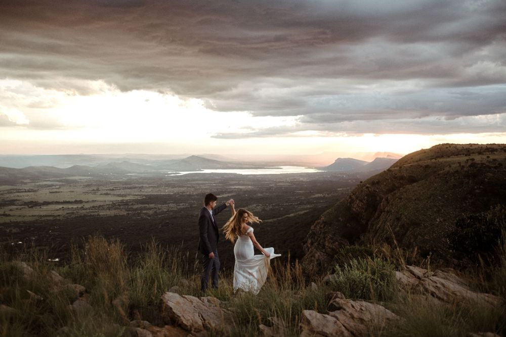 Groom spinning bride with wonderful views of Harties. Intimate Weddings at Intiem Weddings Gauteng