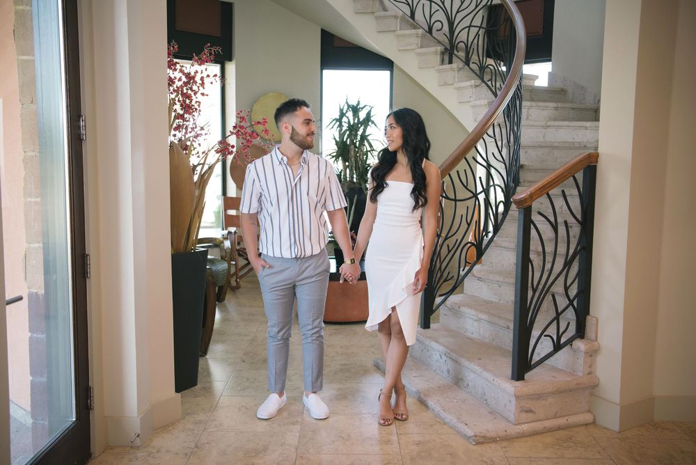 Couple holding hands at their photo session at rancho guadalupe