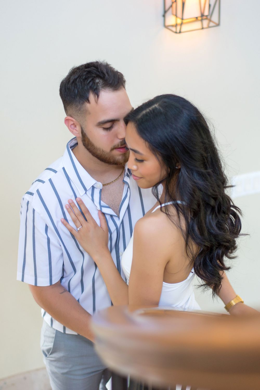 Couple cuddling each other at a photo session at rancho guadalupe