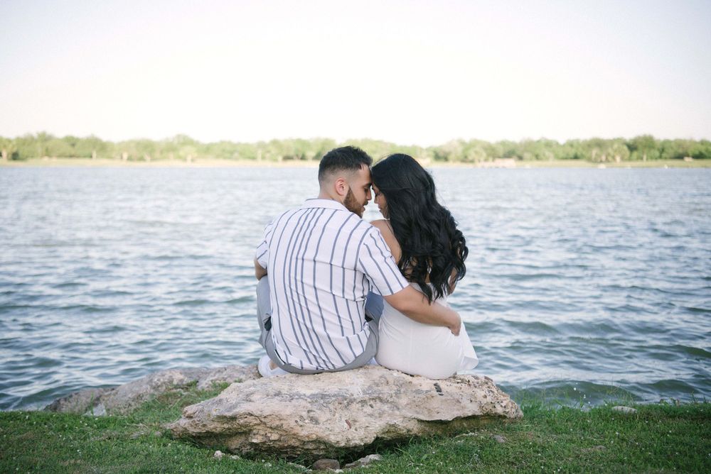 Couple enjoying the view of the lake at rancho guadalupe edinburg texas