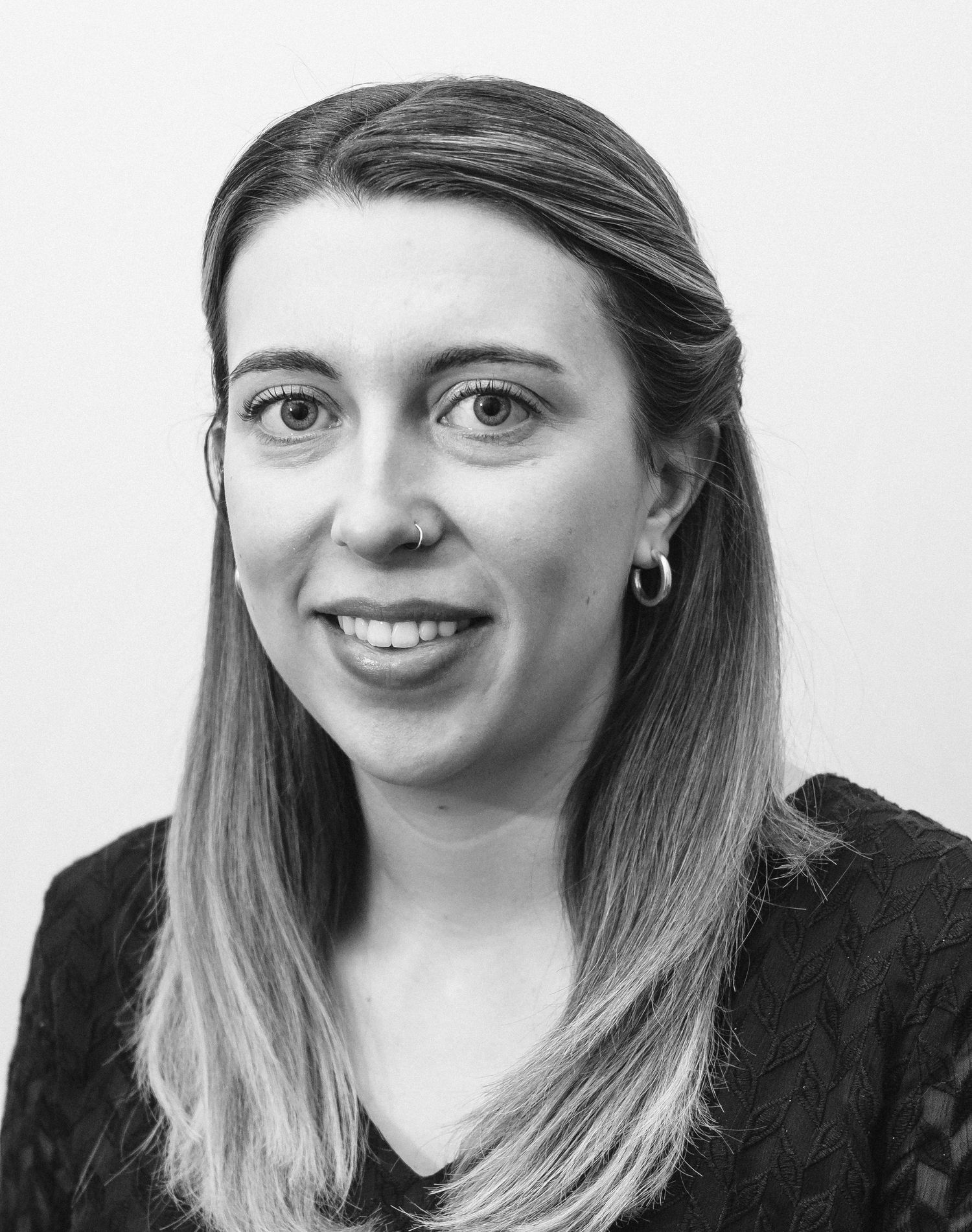 A young professional poses for a traditional headshot in Brunswick, Maine.