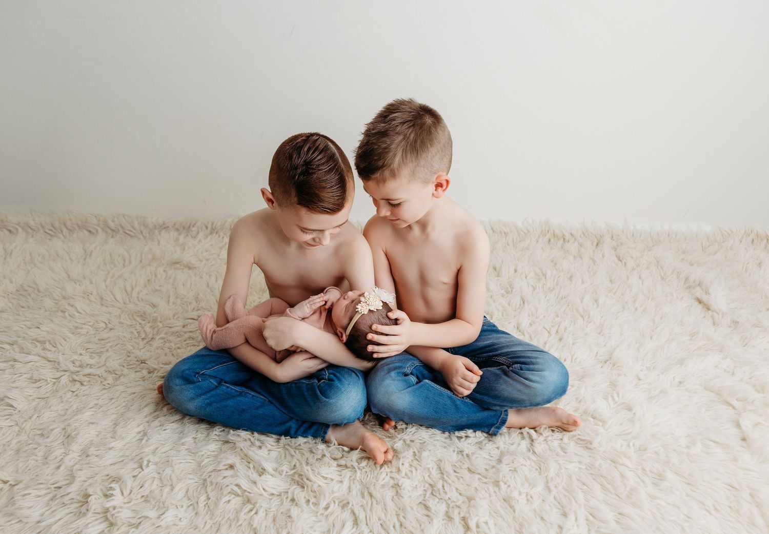 siblings newborn posed photographer studio trained skilled professional session