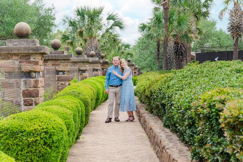 couple portrait wearing blue in garden Horseshoe Bay