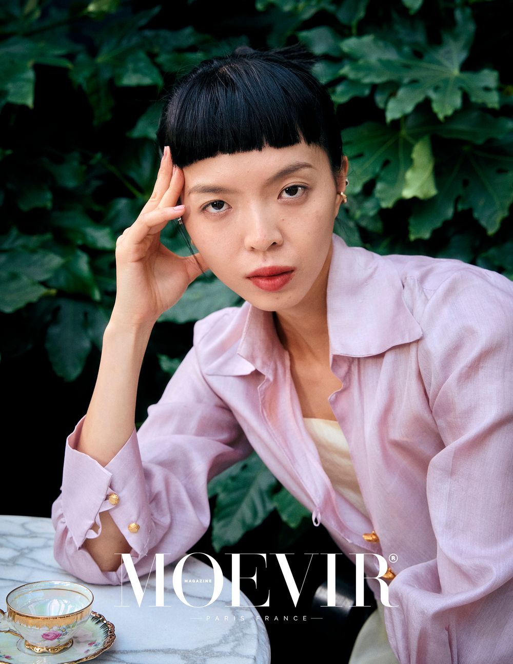 Elegant fashion shoot for magazine editorial with soft pastel tones and flowy fabric.