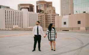 Sergio Galvan Photography captures a breathtaking moment between a couple as they gaze out at the city view of downtown