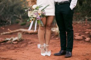 Sergio Galvan Photography captures intricate details of a couple's love in Sedona, featuring the natural beauty of the r
