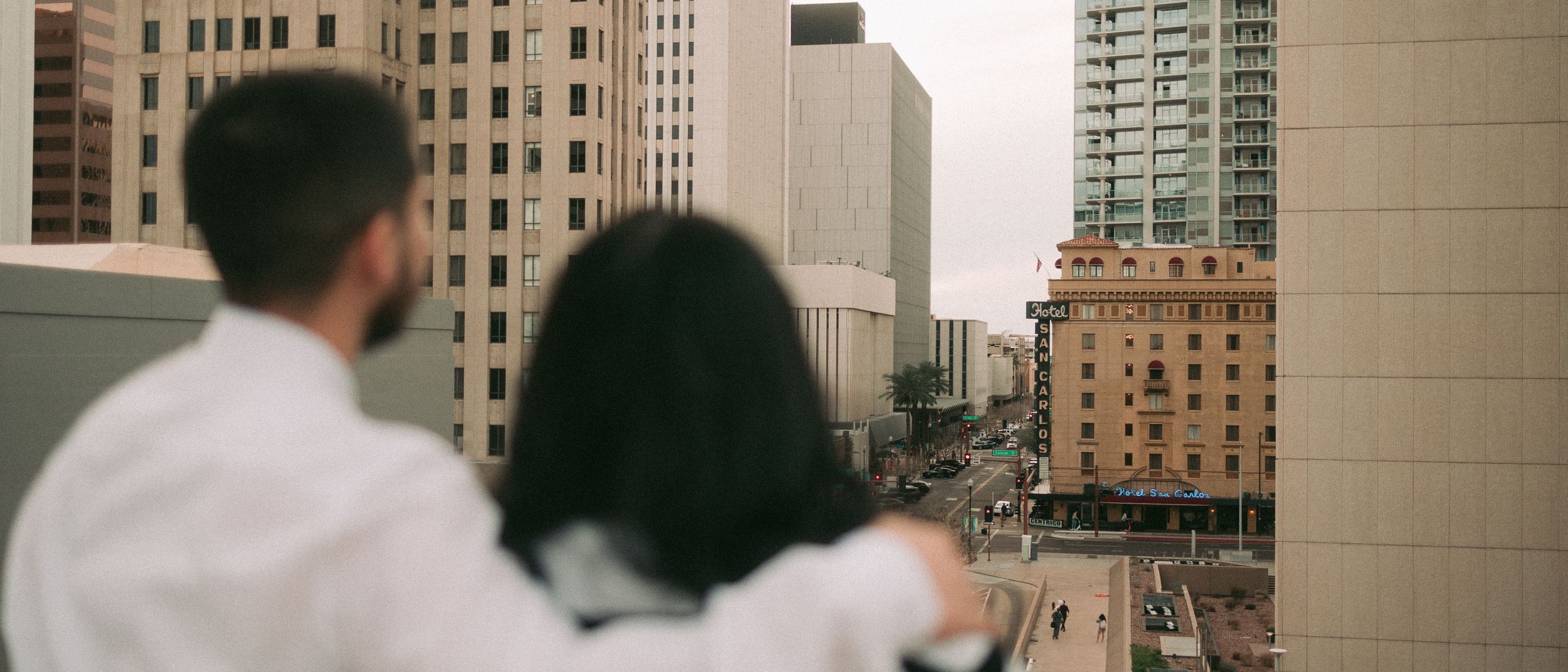 Sergio Galvan Photography captures a stunning moment between a couple as they admire the cityscape of downtown Phoenix