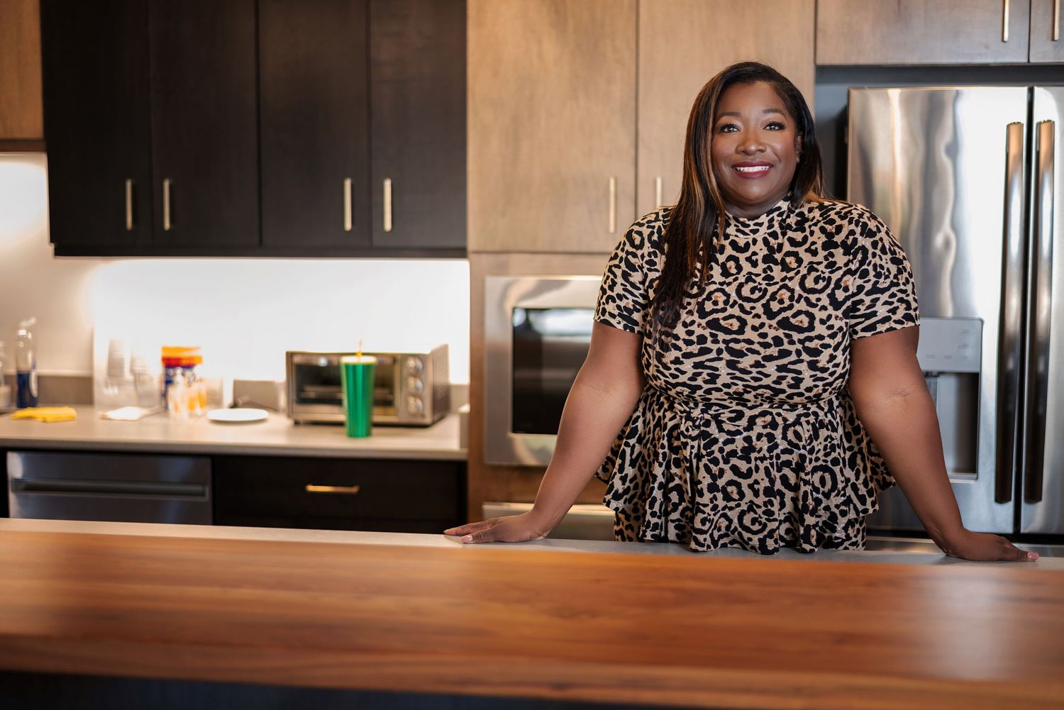 Branding photo of a female entrepreneur with her product line in Evans, GA