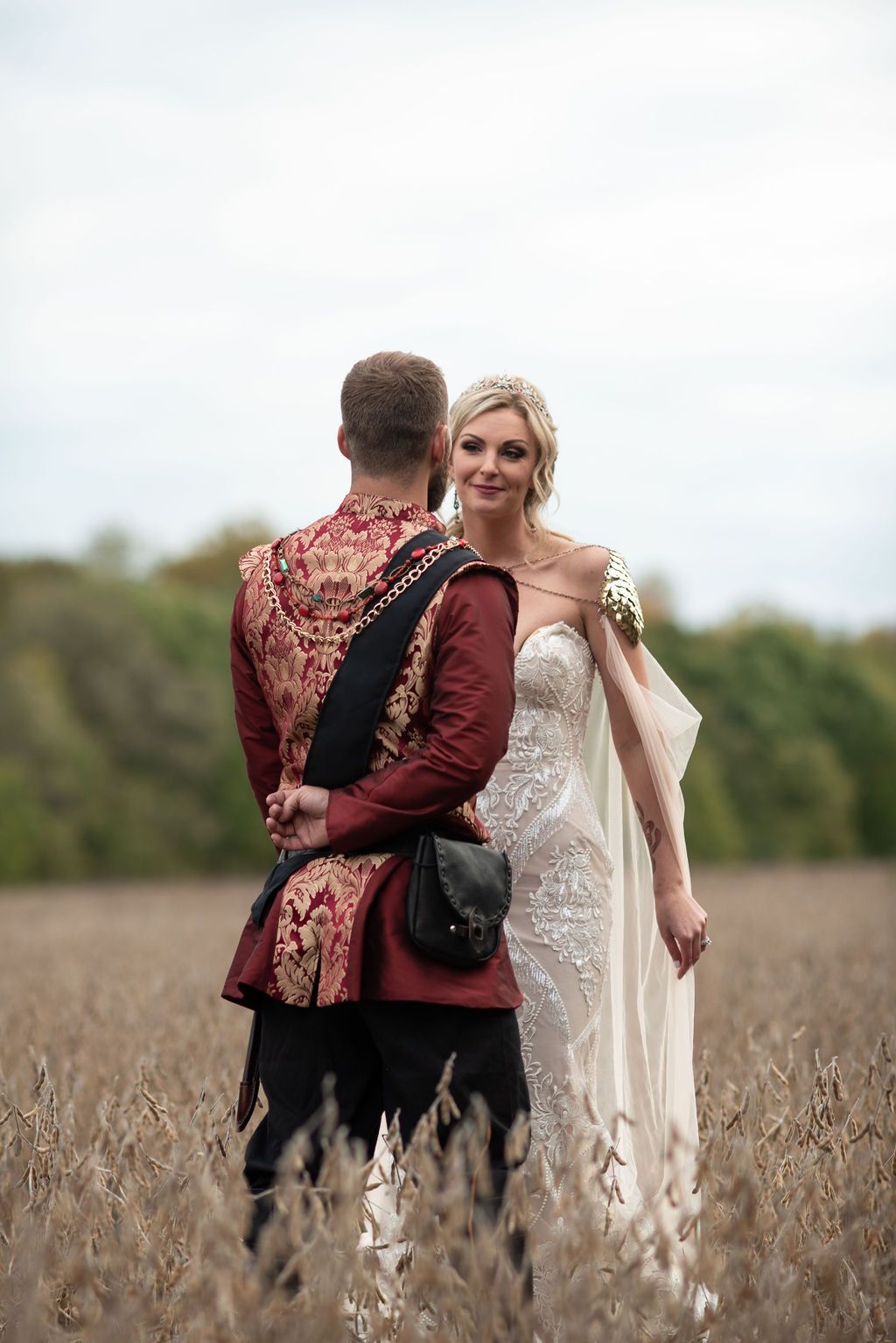 Bride and Groom Standing In Field at Medieval Themed Wedding