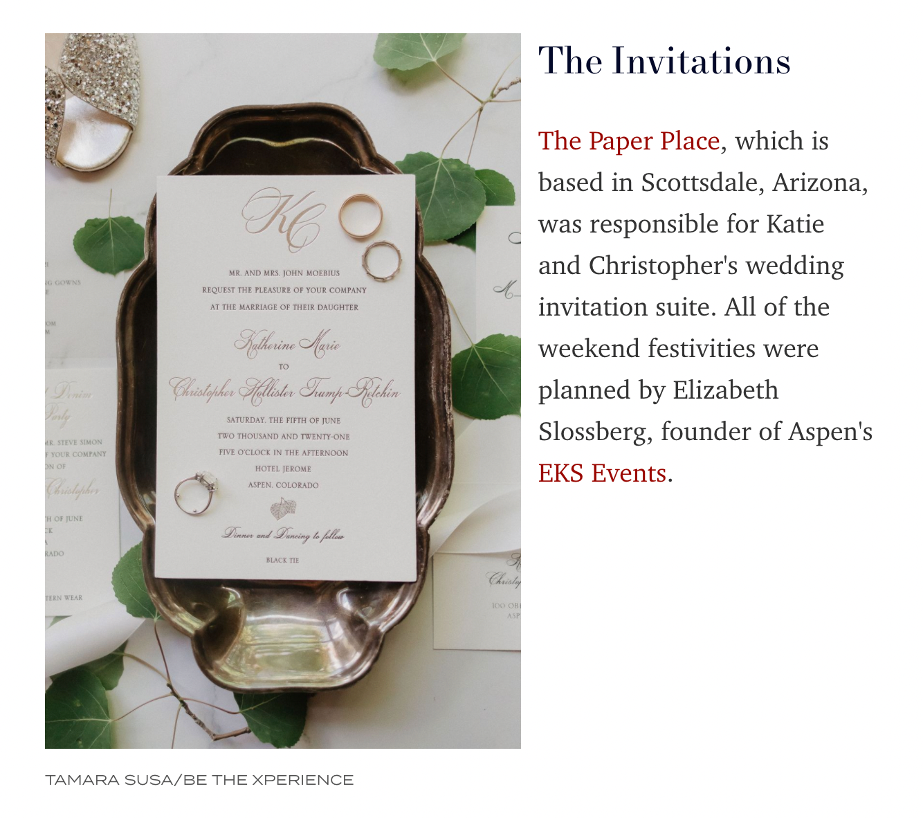 Elegant wedding invitation suite displayed with eucalyptus leaves and gold accents.