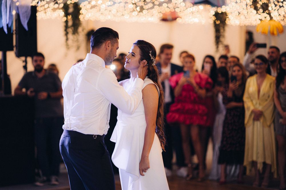 Couple shares an intimate moment during their first dance at wedding reception.