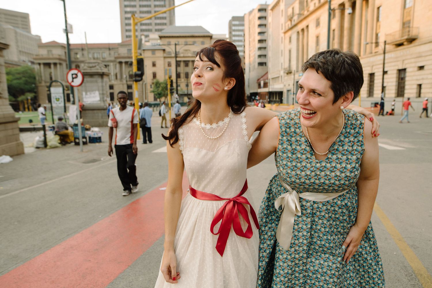 A lesbian couple on their wedding day walking around Copenhagen