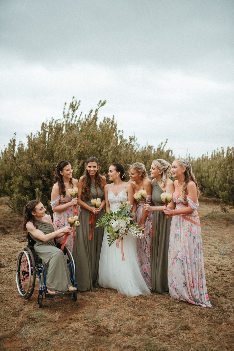 A bride and her bridesmaids laughing together in Harmonie Proteas venue in South Africa