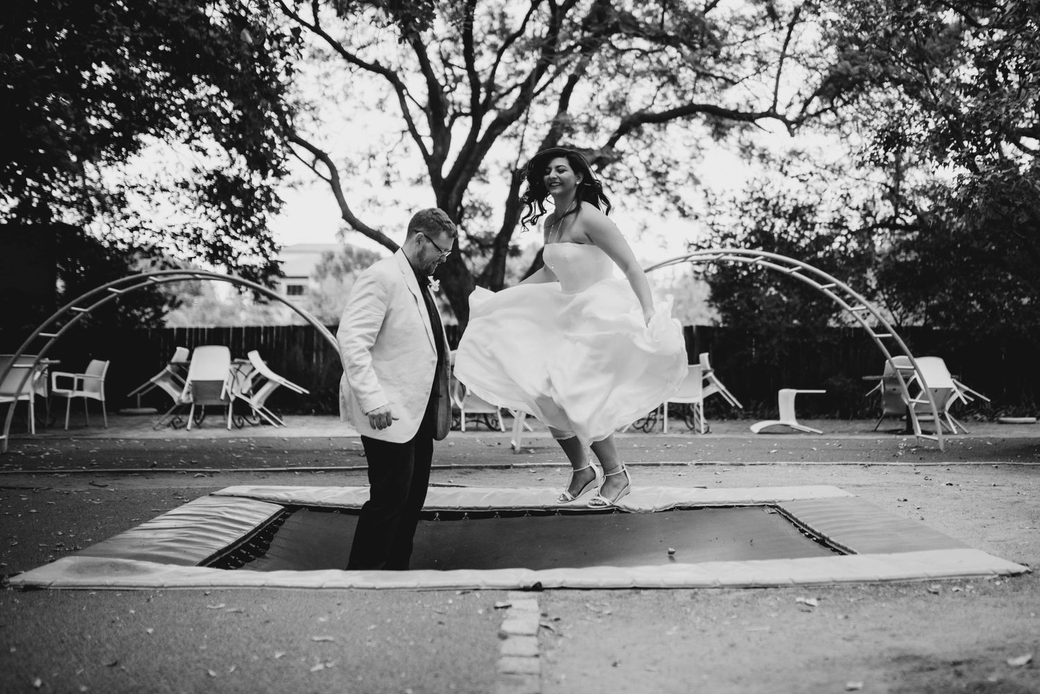 A couple on their wedding day jumping in Copenhagen