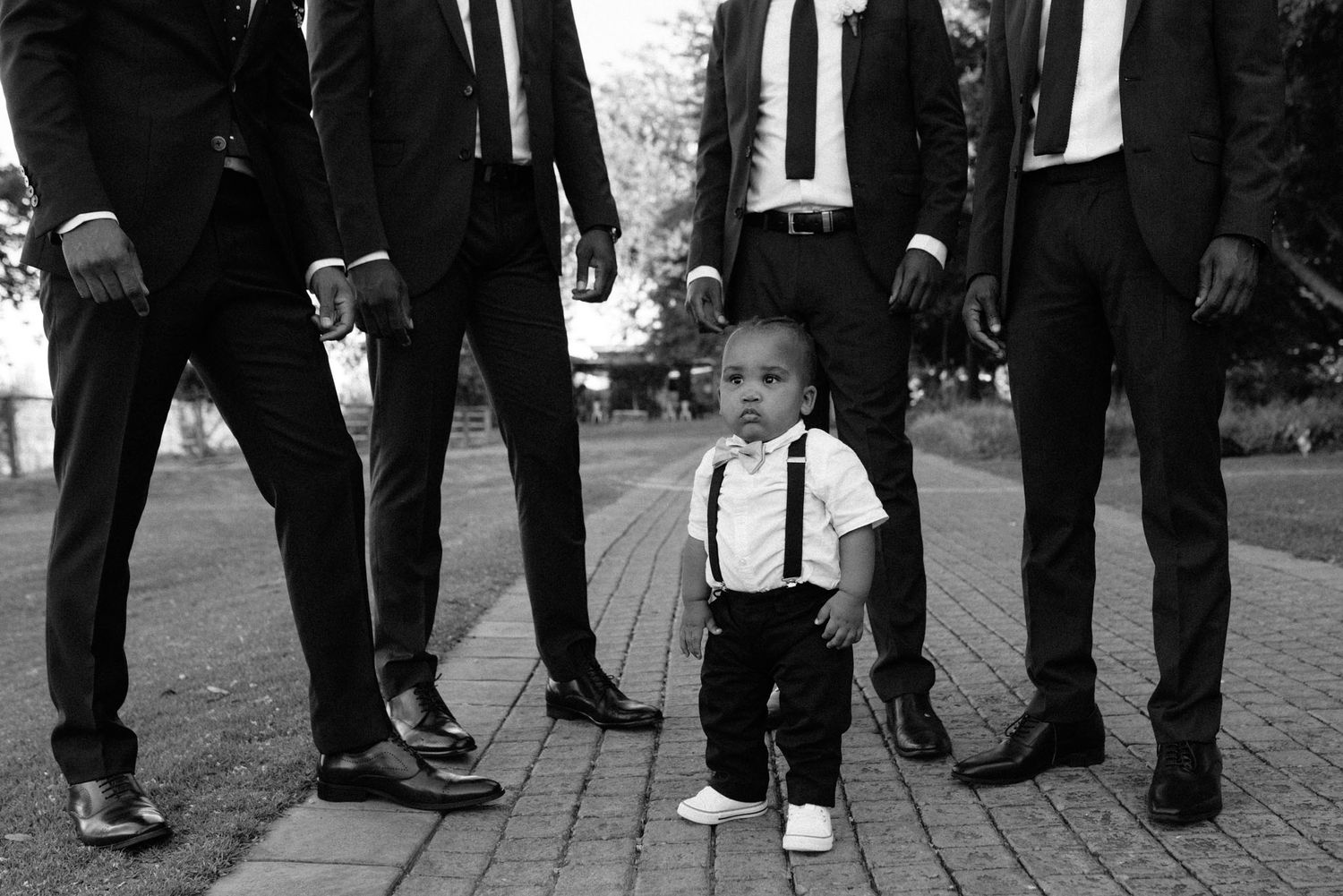 Groomsmen and a baby at Nimb Hotel in Copenhagen