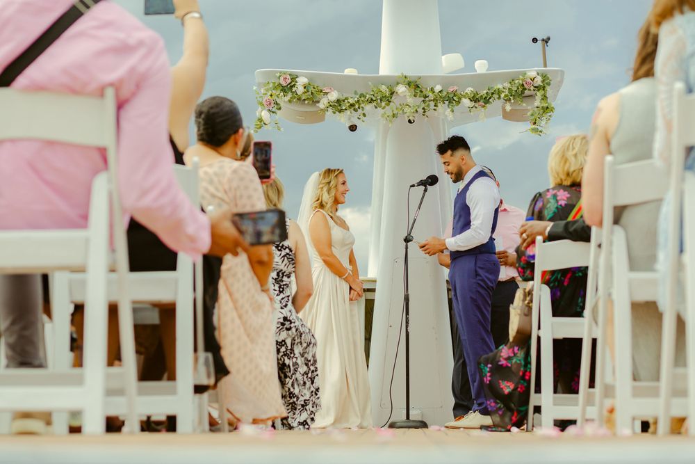 creative-candid daylight wedding photos of the vows reading in front of guests at the Yacht Starship in Tampa, Florida