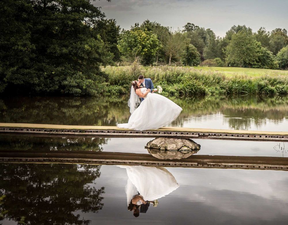 Bride and groom on bridge