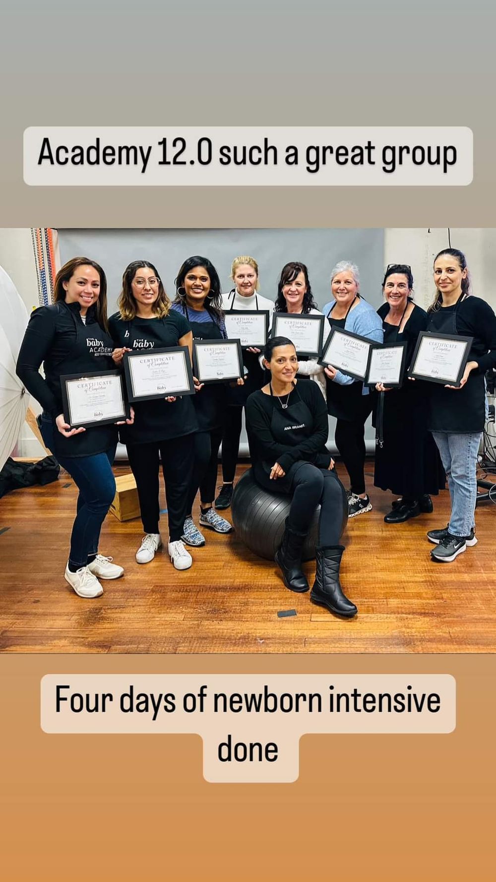 Group photo of photography academy graduates holding certificates after completing newborn intensive training.