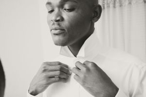 photo of groom preparing