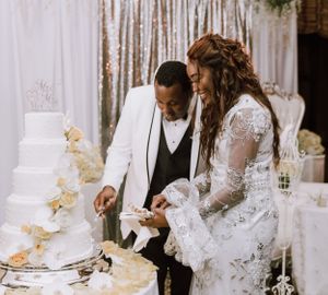 cutting the wedding cake. Bride and groom
