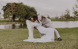 bride and groom outside kiss
