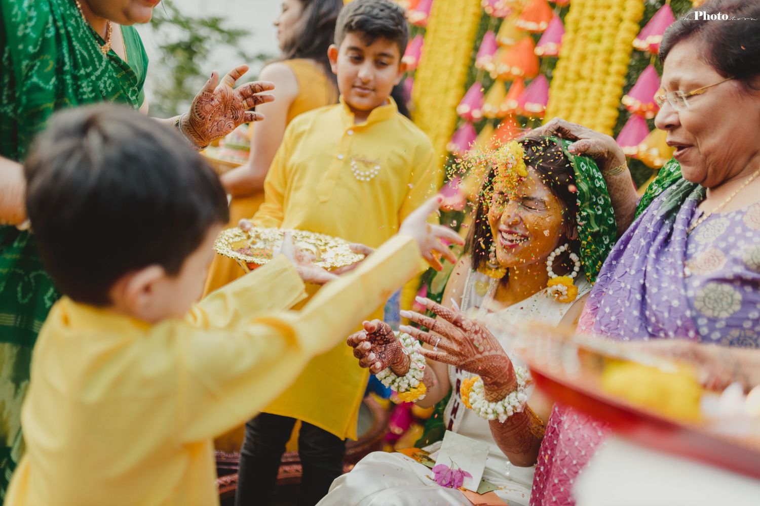 Festive Indian wedding celebration with bright decorations and traditional ceremonial activities.