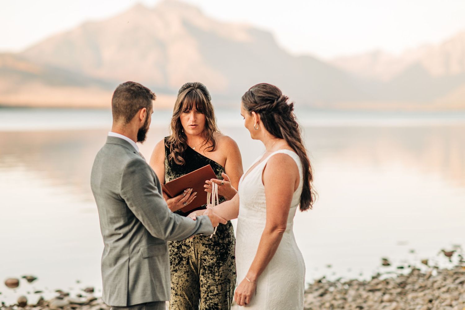 couple getting married at lake McDonald in glacier national park