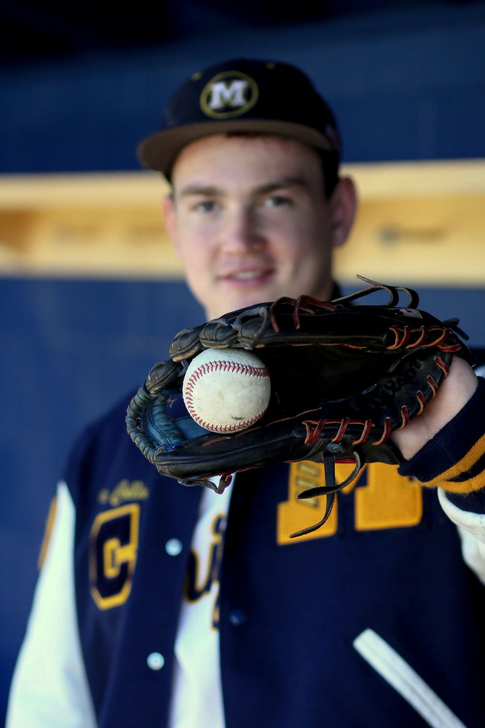 Senior portrait with baseball glove and letterman's jacket in Menlo Park, California