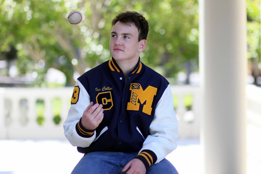 Senior portrait with letterman's jacket in Atherton, California