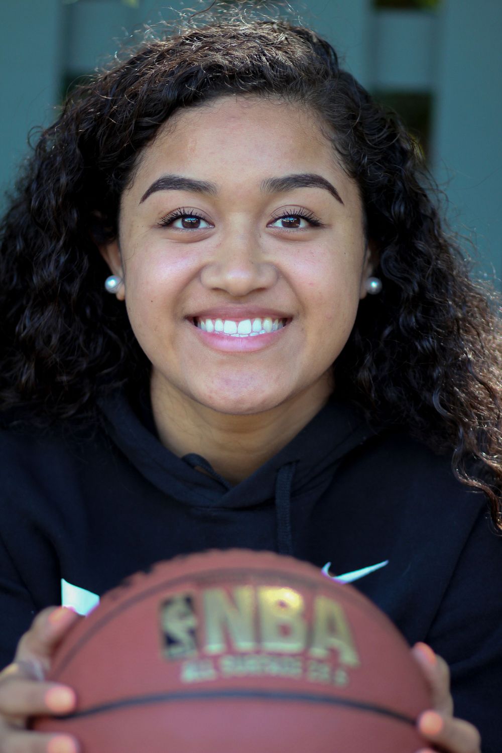 Senior portrait with basketball in Palo Alto, California